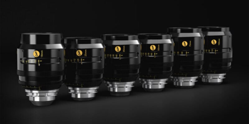 A row of six black Cooke cinema lenses arranged by focal length from 18mm to 100mm against a dark background.