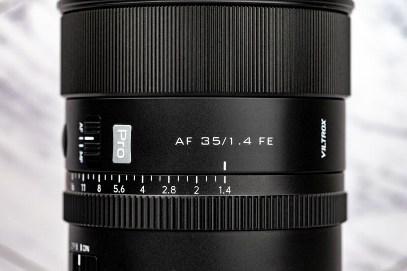 A close-up view of a Viltrox AF 35/1.4 FE Pro camera lens, showing the aperture ring, focus mode switch, and focal length markings.