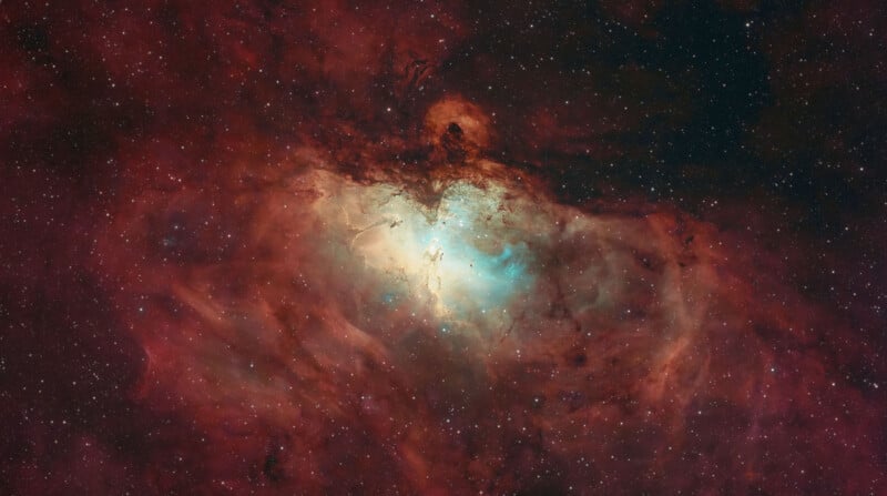 The Eagle Nebula, featuring a bright, glowing central region of ionized gas surrounded by dark, reddish clouds of interstellar dust and stars.