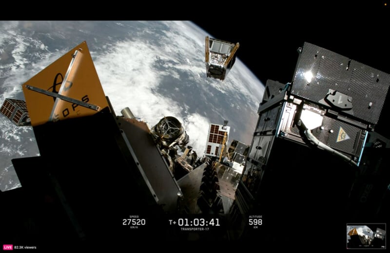 A view from space showing multiple small satellites deploying from a launch vehicle above Earth, with telemetry data displaying speed, time, and altitude.