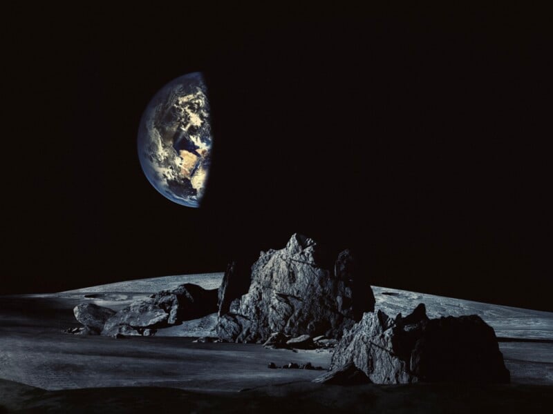 A rocky, cratered lunar landscape under a dark sky with a partially illuminated Earth visible in the distance.