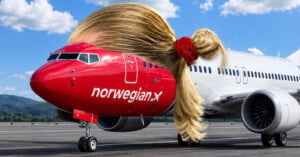A Norwegian Air airplane on a runway has been edited to have a large, blonde ponytail with a red scrunchie on its roof.