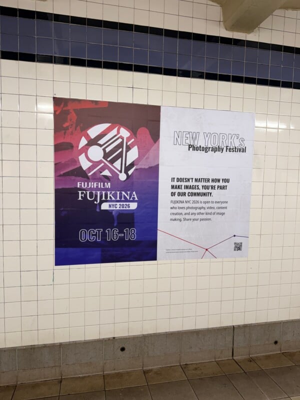 A Fujifilm Fujikina NYC 2026 photography festival advertisement is posted on a tiled subway wall, dated October 16-18.