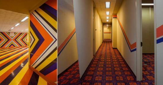 A split-screen view showing a room with bold, chevron-patterned walls and striped floors next to a hallway with patterned carpet.