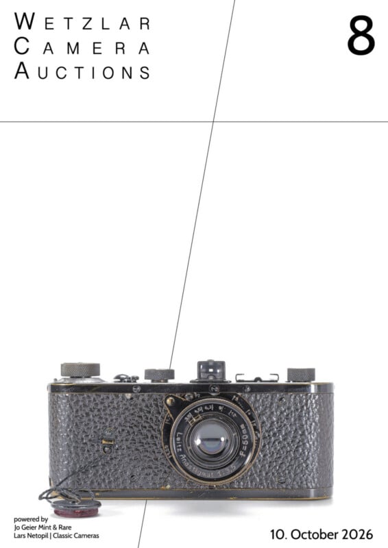 A vintage black Leica camera with a 50mm lens is centered against a white background, with text reading "Wetzlar Camera Auctions 8" and "10. October 2026".