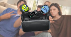 An Insta360 wireless microphone system with two circular transmitters and a receiver unit sits in its open charging case against a blurred background of people.