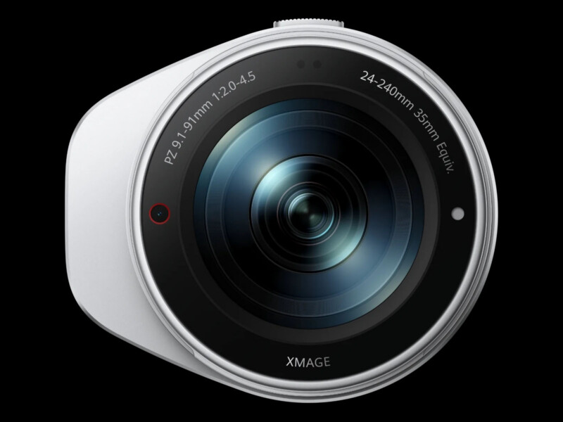 A close-up, front-facing view of a white camera lens with the text "PZ 9.1-91mm 1:2.0-4.5", "24-240mm 35mm Equiv.", and "XMAGE" printed on the rim.