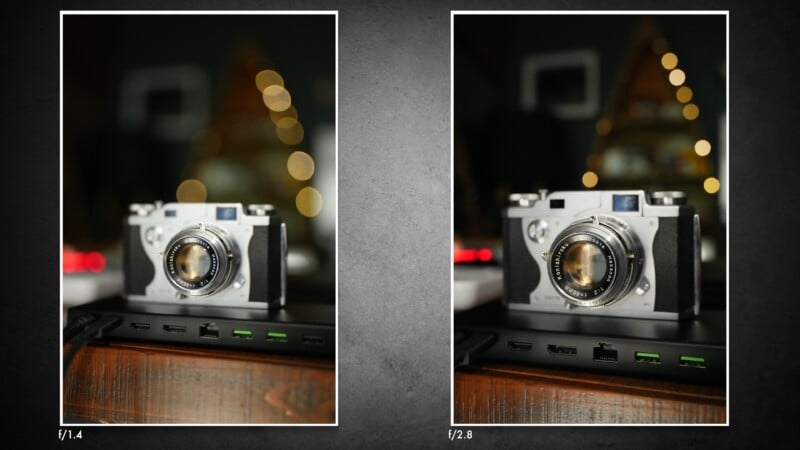 Two side-by-side images of a vintage camera sitting on a docking station, demonstrating the difference in background blur between f/1.4 and f/2.8 apertures.