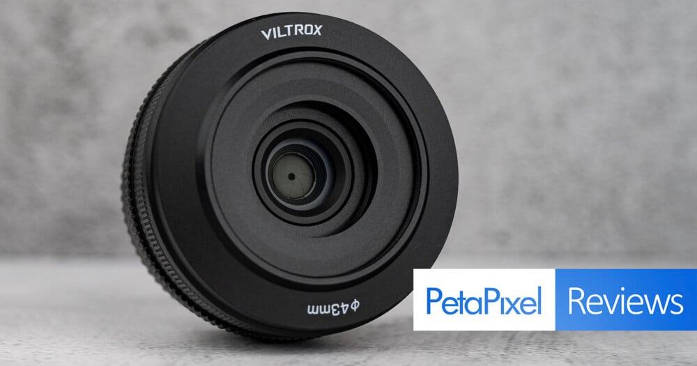 A Viltrox camera lens with a 43mm filter thread size sits on a gray surface, with a PetaPixel Reviews logo in the bottom right corner.