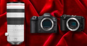 A white Canon RF 70-200mm lens, a Canon EOS R5 Mark II camera body, and a Canon EOS R camera body are arranged against a red velvet background.