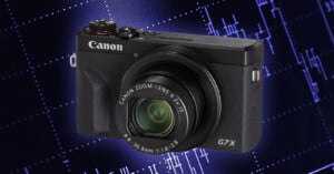 A black Canon PowerShot G7 X Mark III digital camera is centered against a dark blue background with a glowing, abstract digital grid pattern.