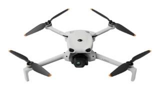 A light gray quadcopter drone with four black propellers featuring orange tips, viewed from the front against a white background, with the text "LITO 1" printed on its right arm.