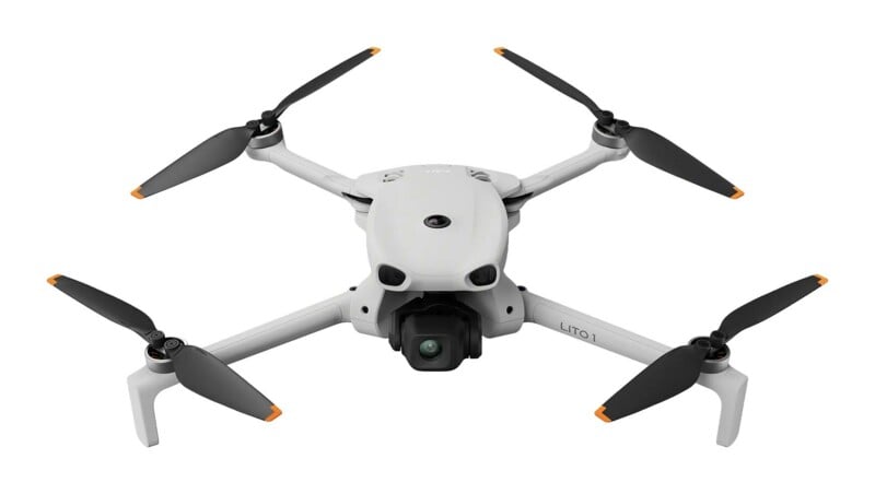 A light gray quadcopter drone with four black propellers featuring orange tips, viewed from the front against a white background, with the text "LITO 1" printed on its right arm.