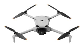A light gray quadcopter drone with black propellers and orange tips, featuring a front-facing camera gimbal and the text "LITO X1" printed on its arm.