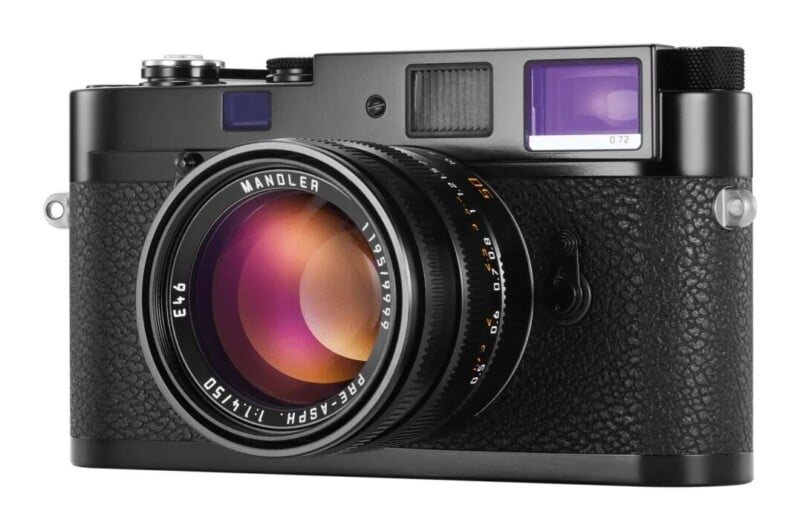 A black rangefinder camera with a 50mm f/1.4 lens attached, featuring text on the lens ring reading "MANDLER," "E46," and "PRE-ASPH.