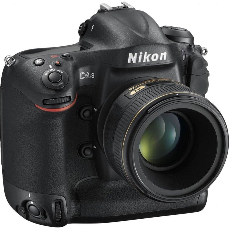 A black Nikon D4s DSLR camera with a lens attached, viewed from the front-right angle.