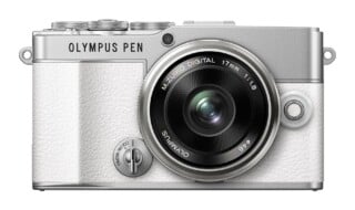 A silver and white Olympus PEN digital camera with a 17mm f/1.8 lens, viewed from the front.