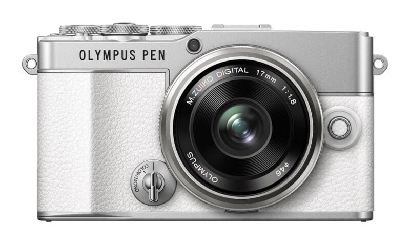 A silver and white Olympus PEN digital camera with a 17mm f/1.8 lens, viewed from the front.