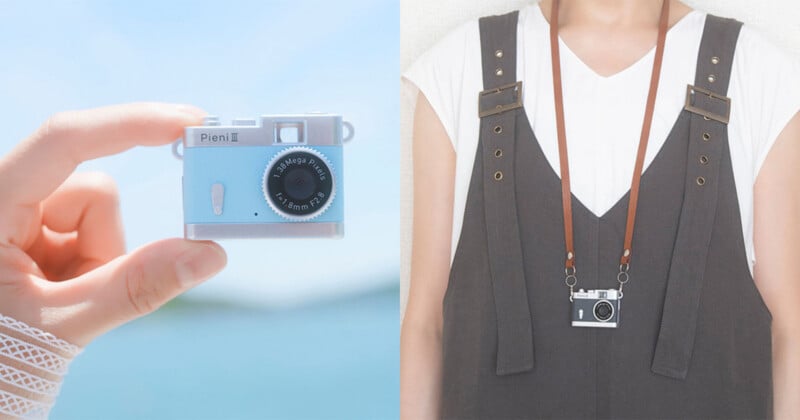 A hand holds a small, light blue Pieni III digital camera on the left, while a person wears a black version of the same camera on a brown strap around their neck on the right.