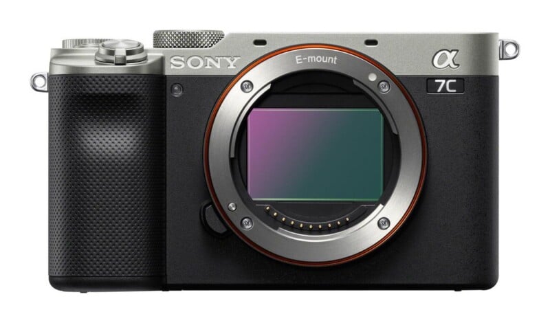Front view of a silver and black Sony Alpha 7C mirrorless camera body with an E-mount lens opening.