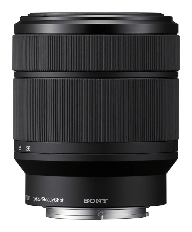 A black Sony camera lens with a ribbed focus ring, marked with focal lengths 28 and 35, and the text "OpticalSteadyShot" near the metal mount.