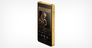 A gold-colored Sony Walkman digital music player is shown at an angle, displaying a saxophone album cover on its screen with playback controls.