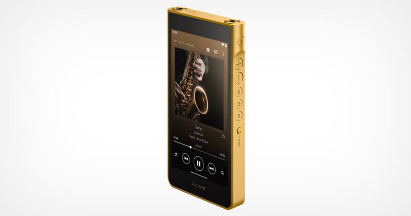 A gold-colored Sony Walkman digital music player is shown at an angle, displaying a saxophone album cover on its screen with playback controls.