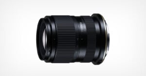 A black Tamron 16-50mm F2.8 camera lens shown from the side against a white background.