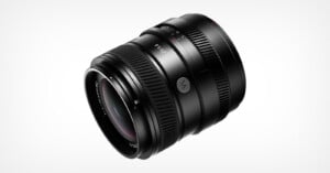 A black camera lens with a 23mm focal length and f/1.4 aperture, featuring a ribbed focus ring and a manual aperture ring, set against a plain white background.