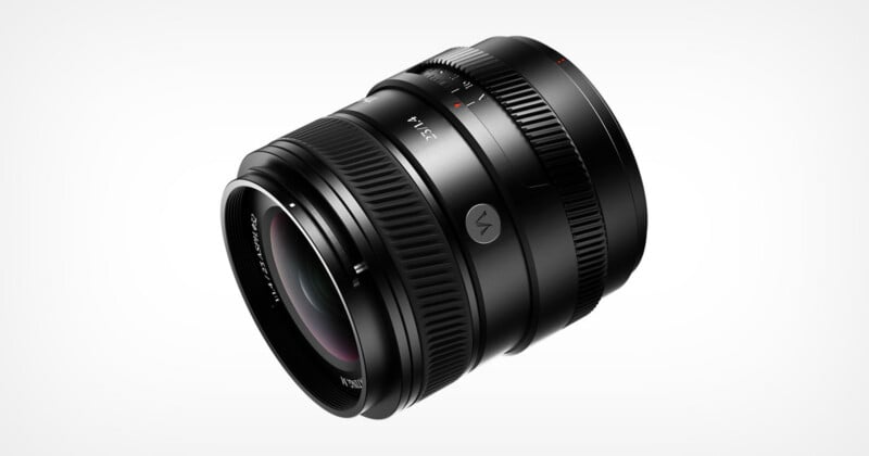 A black camera lens with a 23mm focal length and f/1.4 aperture, featuring a ribbed focus ring and a manual aperture ring, set against a plain white background.
