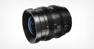 A black cine lens with a 100mm T1.9 focal length and aperture marking, shown from a three-quarter angle against a white background.